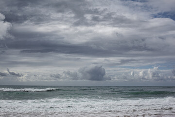Cloud and waves on the beach