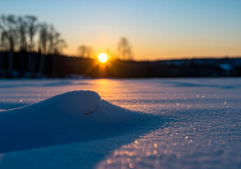 Bright Sunset Sunburst Over Sparkling Snow Field winter