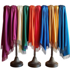 colorful shawls on display stands on white background.