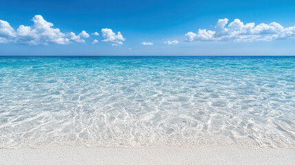 Fototapeta premium Crystal clear sea under blue sky with gentle waves and soft white sand creates serene atmosphere