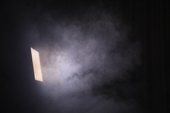 Professional lighting equipment without reflector and smoke on dark background. Space for text