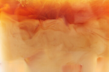 Obraz premium Tasty coffee with ice and milk as background, closeup