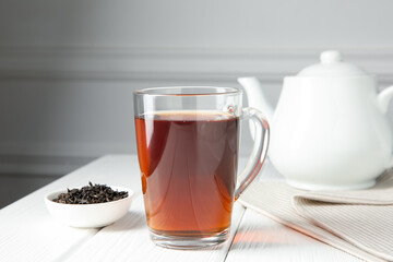 Delicious tea and brew served on white table