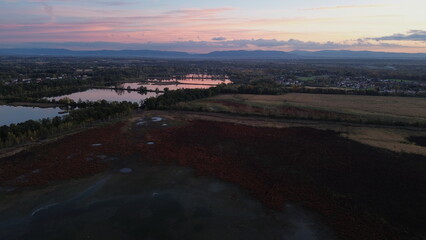 Aerial view of drained lake and countryside at sunset