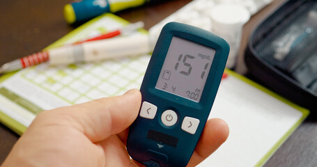 Displaying a glucometer reading of 151 mg, this clip illustrates the importance of monitoring glucose levels for effective diabetes management and health awareness.