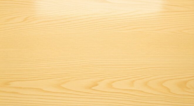 Closeup of light brown wood grain with straight parallel lines and swirling patterns