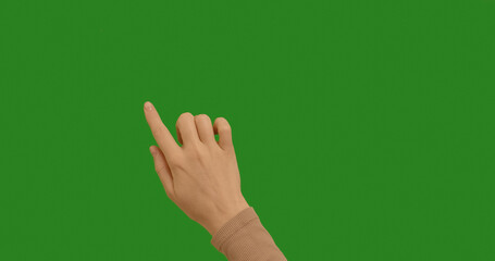 Woman hand making gestures lines, curves, graphics on chroma key green screen background. Dragging...