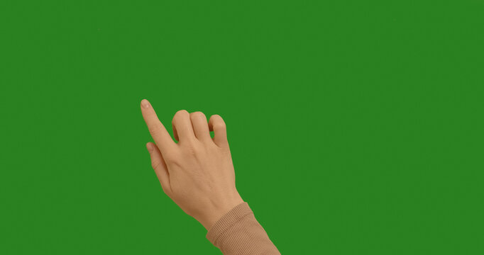 Woman hand making gestures lines, curves, graphics on chroma key green screen background. Dragging and Swiping on Chroma Key Green Background, like using a Smartphone, Tablet Pc or a Touchscreen. - Powered by Adobe