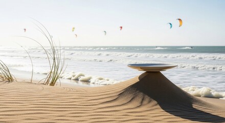 Abstract composition with plate on sand dune by ocean and kiteboarders