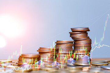 Investment Growth Concept with Stacked Coins and Rising Graph. Stacked coins with upward green arrow and financial graph showing investment growth, profit increase, and financial success concept.