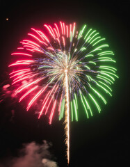 Vibrant multi colored fireworks exploding against a pure black background. Festive celebration concept for holidays, events, posters, and party designs