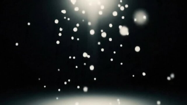 Soft glowing white particles floating in the air on a dark blurred background. Great for snow, dust, bokeh, or dreamy abstract scenes.