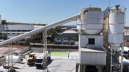 Aerial drone view of industrial cement plant and construction materials factory