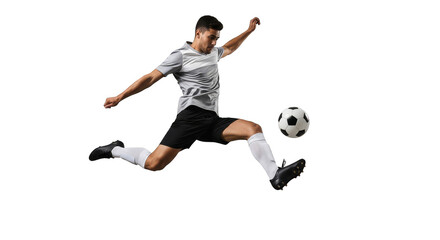 Leaping athlete powerfully kicks soccer ball