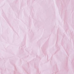 Pink crumpled paper background. Texture of crumpled paper, top view, copy space.