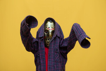 Creepy Halloween Kid: Child in Horror Hockey Mask and Scarecrow Costume