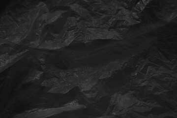 Black plastic bag texture background. Reuse and Recycle concept.