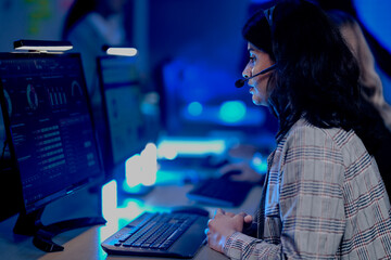Data analyst deep dive night shift analyzing complex metrics visualizations dashboard screen headset facilitates remote team collaboration insights extraction critical business intelligence.