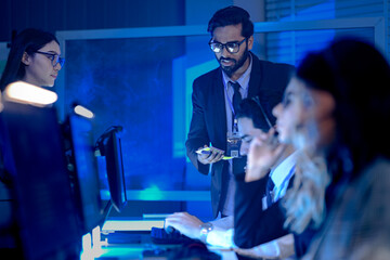 Future AI performance review human team analyzes model output metrics comparing AI generated charts tablet data verify ethical alignment autonomous system operations center night mode active.