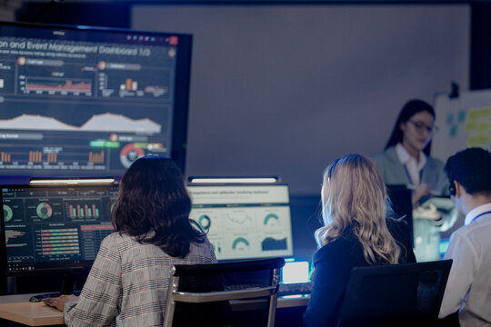 Global security watch active Diverse analysts monitor world map threat intel screens leader coordinates response strategy critical vigilance protects assets worldwide team focus now protect.