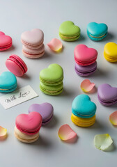 Obraz premium Romantic Heart-Shaped Macarons with Rose Petals and 'With Love' Card, Perfect for Valentine's Day or Mother's Day