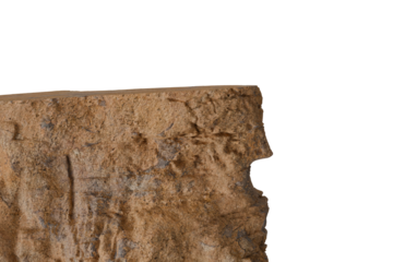 Close-up of a rugged, textured surface of a weathered, ochre-brown stone or aged wall, displaying cracks and imperfections, starkly contrasting with a deep black void