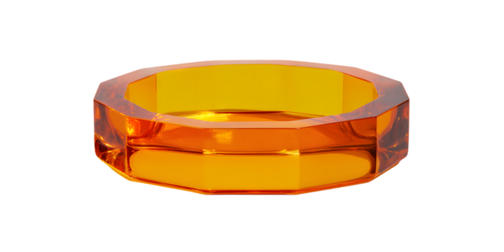 Octagonal amber glass ring with faceted sides on black background