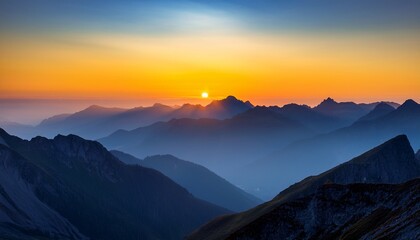 Obraz premium silhouetted mountain ranges at dawn