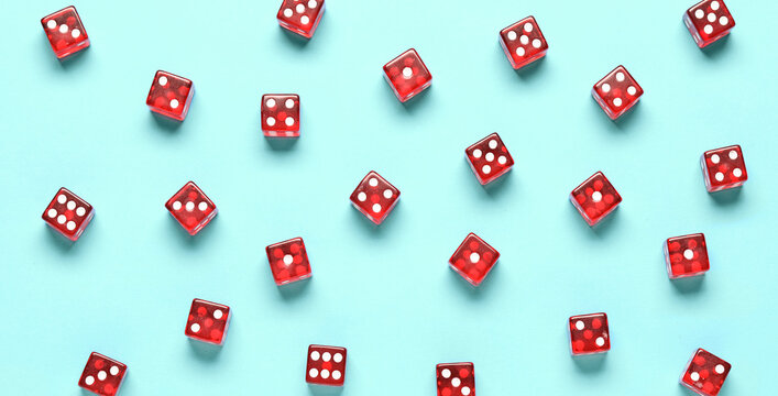 Red game dices on blue background