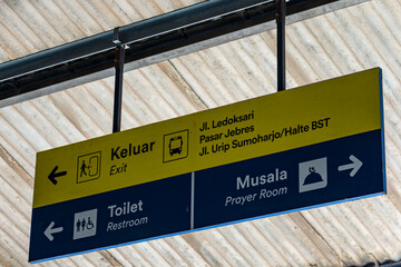 Indonesian Directional Signboard with Exit, Toilet, and Prayer Room Information at Public Terminal
