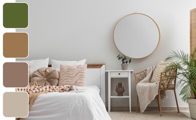 Stylish interior of bedroom. Different color patterns