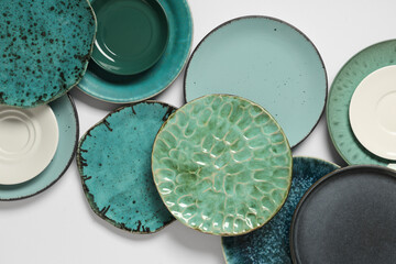 Set of green plates on white background