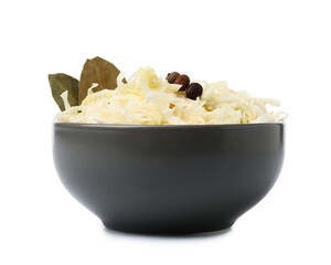 Bowl with tasty sauerkraut, peppercorns and bay leaves on white background