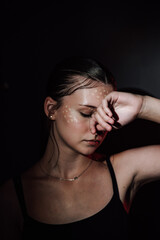 Obraz premium Portrait of a girl on a dark background. Makeup.