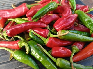 lots of red and green hot peppers close-up