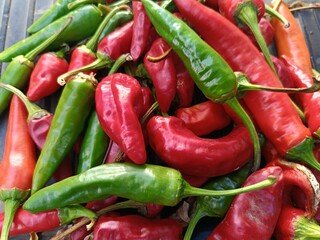lots of red and green hot peppers close-up