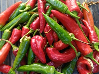 lots of red and green hot peppers close-up