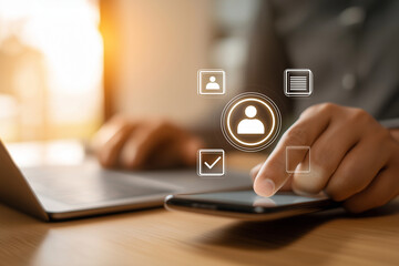 Person using smartphone and laptop with social media icons overlay modern technology communication