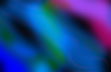 Abstract blurry background with vibrant diagonal streaks of blue teal green and purple creating a dynamic and energetic visual effect