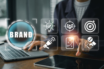 A professional working on a laptop, surrounded by digital branding icons, illustrating modern marketing strategies.