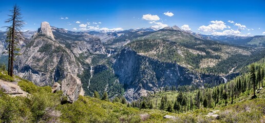 Yosemite National Park. Beautiful scenery with mountains, cliffs, wild rivers, waterfalls, and lakes. A fantastic outdoor vacation spot. Pure nature. Traveling in the USA. High quality photo