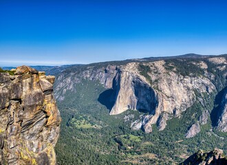 Yosemite National Park. Beautiful scenery with mountains, cliffs, wild rivers, waterfalls, and lakes. A fantastic outdoor vacation spot. Pure nature. Traveling in the USA. High quality photo