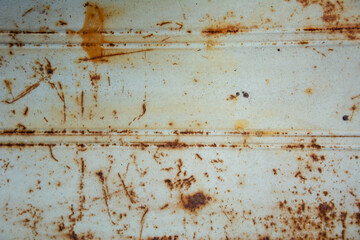 Rusty metal surface with weathered orange corrosion and vintage industrial texture