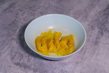 Fried potstickers or dumplings in bowl