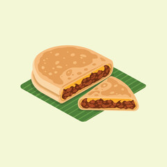 Delicious Beef Empanada Cut in Half on Green Leaf.