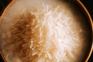 Long grain white rice gently steaming in a bowl ready for a delicious meal
