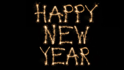 New Year's Eve greeting card holiday concept template - sparkler trails font lettering sparkler writing script text "HAPPY NEW YEAR" isolated on black background