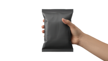 Hand holding a dark gray rectangular snack packet with a matte finish isolated on transparent background