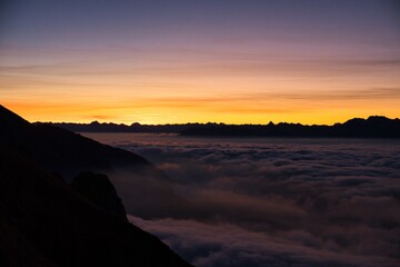 Breathtaking sunrise on the L&uuml;tispitz in Toggenburg. Sunrise above the sea of ​​fog in the Alpstein region. Wonderful mountain panorama. High quality photo.