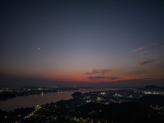 Soothing view of Bridge and Brahmaputra River at Twilight with Crescent Moon 